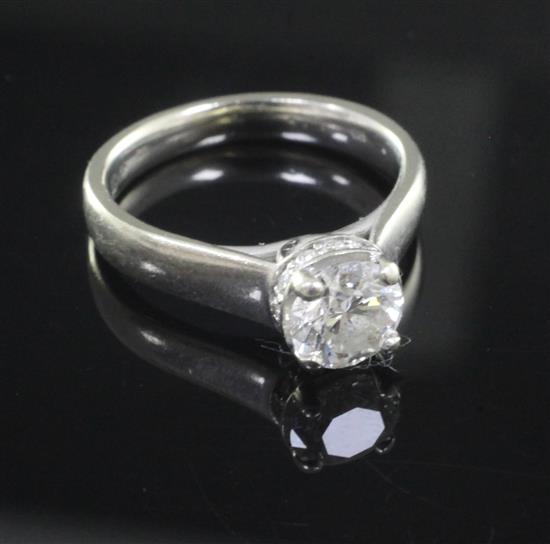 A diamond solitaire ring, white gold setting (jewellers certification: carat 1.14, colour: J, clarity SI1), size K/L.